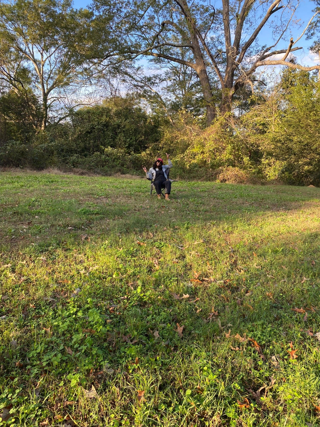 Founder of Blossom & Buzz Community standing on land purchased in November 2024 in West Jackson, Mississippi, planned for a future community garden